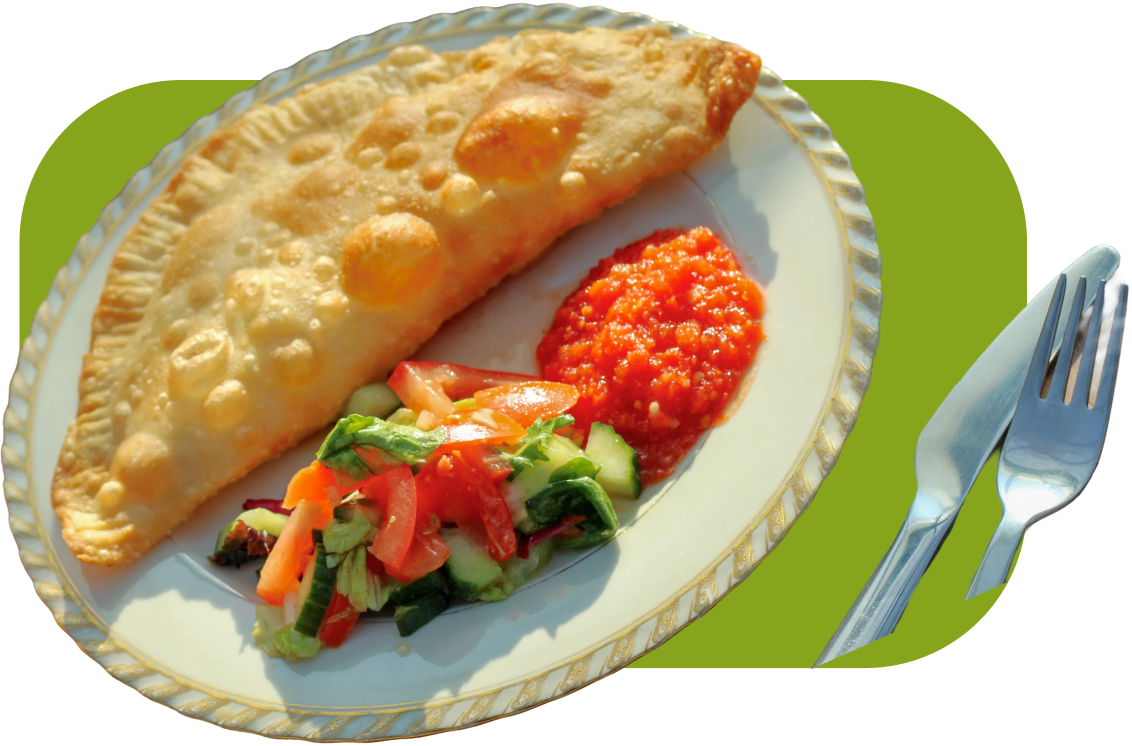 Cheburek with salad and pepper relish on a plate